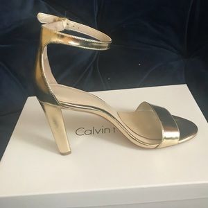 Gold Calvin Klein open toe shoes